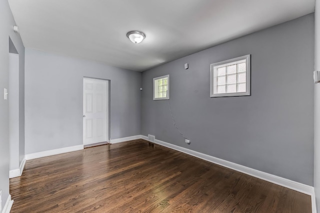 9019 S Justine St, Chicago, IL 60620 - empty room with baseboards and dark wood-style floors