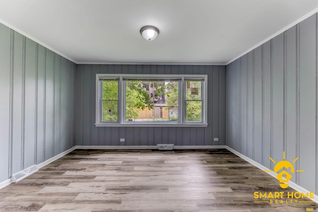 9019 S Justine St, Chicago, IL 60620 - empty room with wood finished floors and ornamental molding