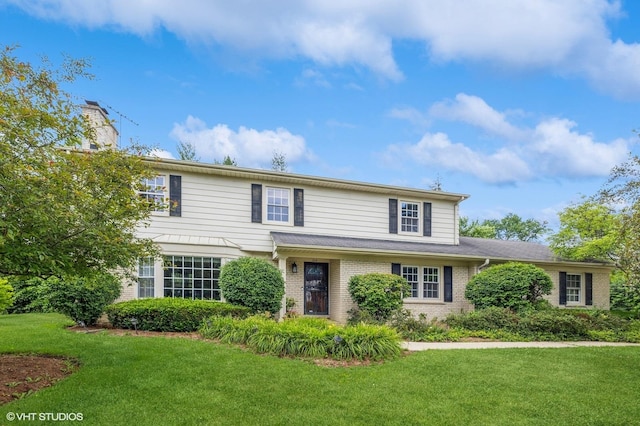 214 S Belmont Ave, Arlington Heights, IL 60005 - traditional-style house with a front yard and brick siding