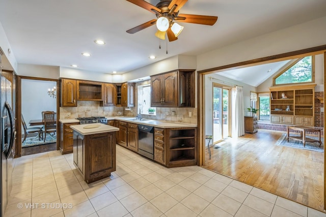 214 S Belmont Ave, Arlington Heights, IL 60005 - kitchen featuring open shelves, dishwashing machine, light tile patterned flooring, light countertops, and a kitchen island