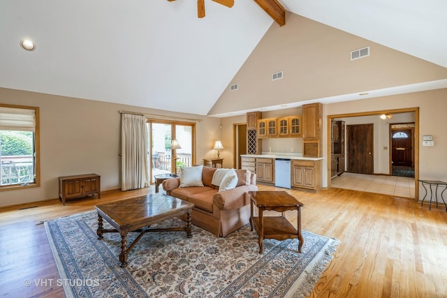 214 S Belmont Ave, Arlington Heights, IL 60005 - living room featuring high vaulted ceiling, beam ceiling, light wood-style floors, plenty of natural light, and wet bar
