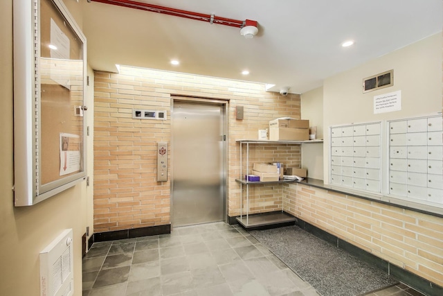 1430 S Michigan Ave Unit 510, Chicago, IL 60605 - view of home's community featuring mail area, brick wall, and recessed lighting