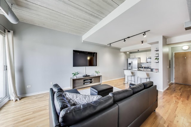 1430 S Michigan Ave Unit 510, Chicago, IL 60605 - living area with rail lighting and light wood-style flooring