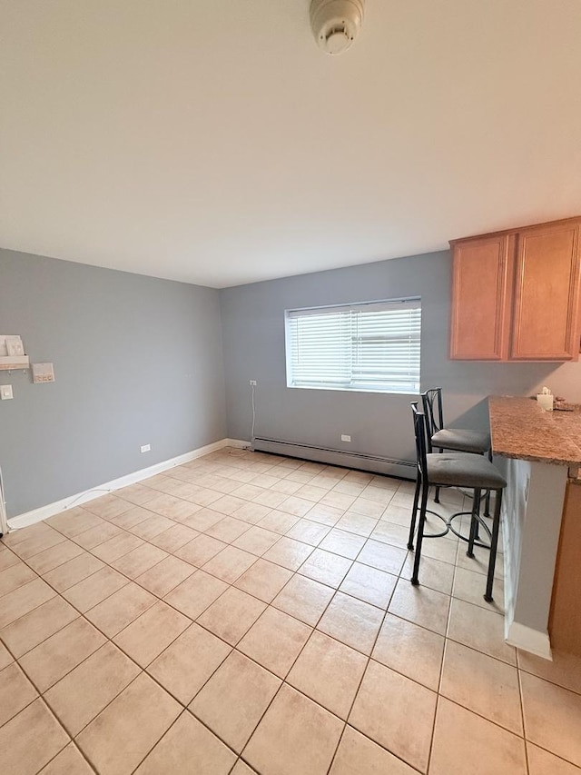 4620 Fishermans Ter Unit Ge, Lyons, IL 60534 - unfurnished dining area with baseboard heating and light tile patterned floors