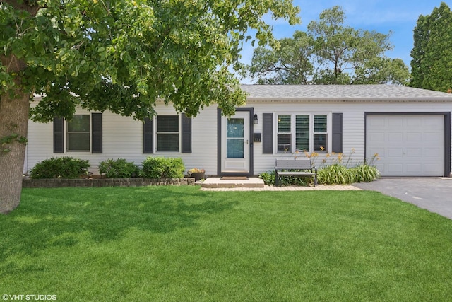 521 Everette Ave, Romeoville, IL 60446 - view of front facade with a garage, asphalt driveway, a front lawn, and roof with shingles