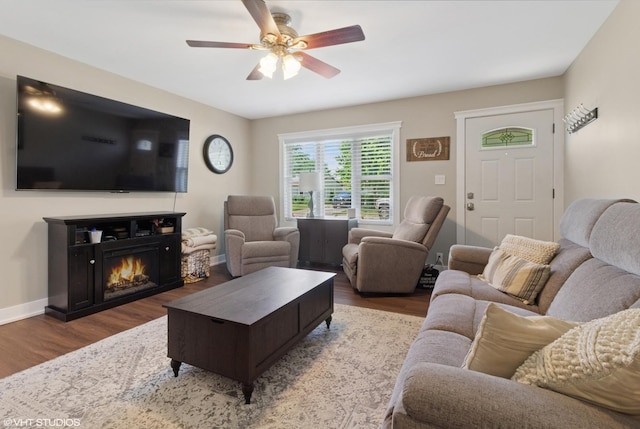 521 Everette Ave, Romeoville, IL 60446 - living area featuring wood finished floors, a ceiling fan, and a warm lit fireplace