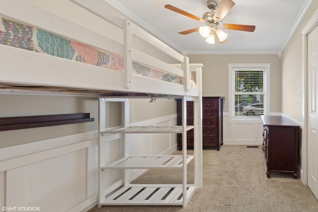 521 Everette Ave, Romeoville, IL 60446 - unfurnished bedroom with ornamental molding, light carpet, a wainscoted wall, and ceiling fan