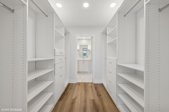 1140 Old Mill Rd Unit 505F, Hinsdale, IL 60521 - walk in closet with wood finished floors