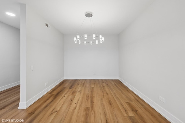 1140 Old Mill Rd Unit 505F, Hinsdale, IL 60521 - unfurnished dining area with light wood-type flooring and a chandelier