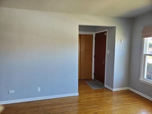 605 Hoxie Ave, Calumet City, IL 60409 - spare room with light wood finished floors and baseboards