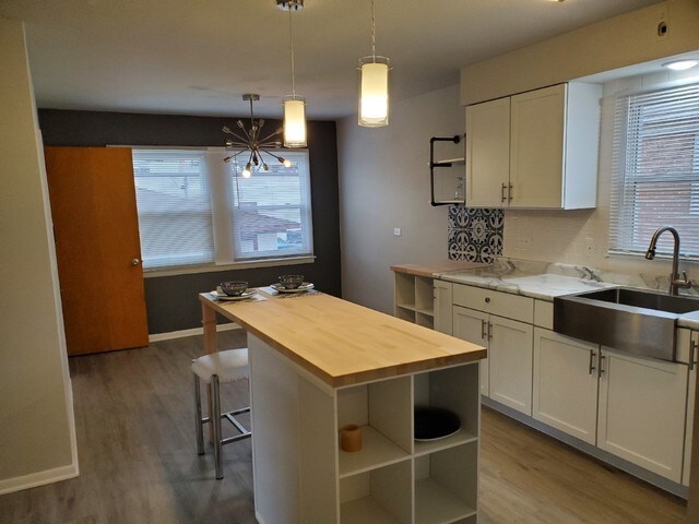 605 Hoxie Ave, Calumet City, IL 60409 - kitchen featuring wooden counters, healthy amount of natural light, and wood finished floors