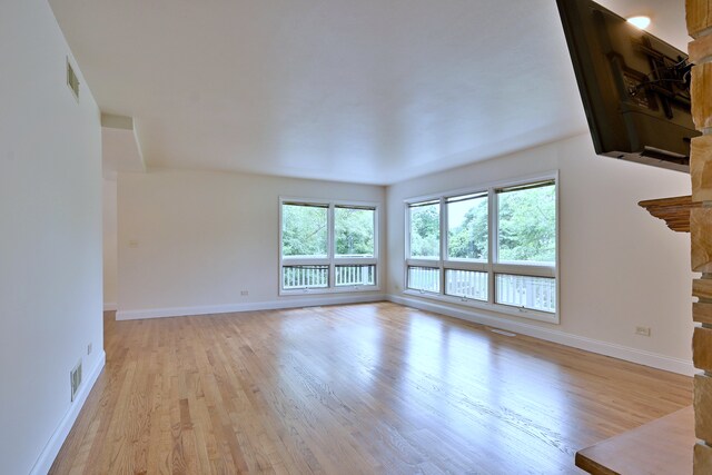 105 Haman Rd, Inverness, IL 60067 - unfurnished living room with light wood finished floors and baseboards