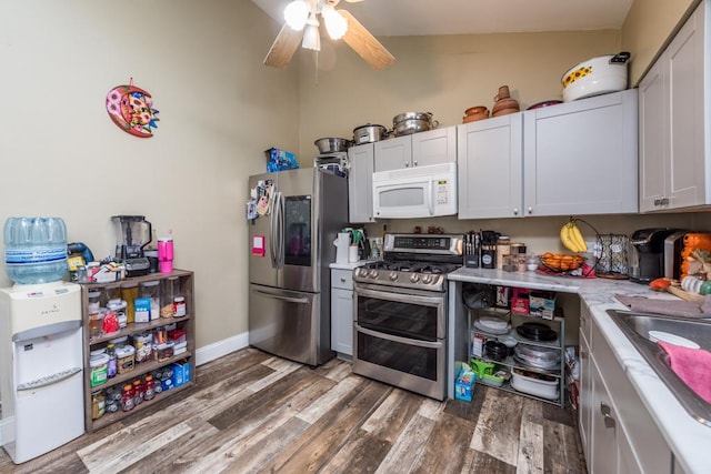 42478 N Lake Ave, Antioch, IL 60002 - kitchen with appliances with stainless steel finishes, wood finished floors, light countertops, and a ceiling fan