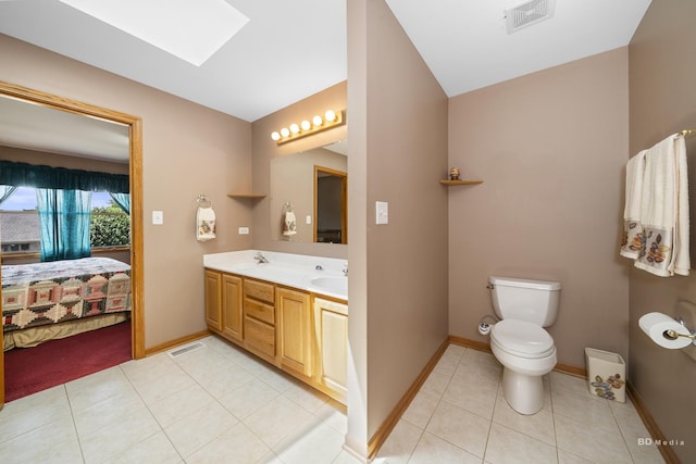 14879 Harbor Dr, Oak Forest, IL 60452 - ensuite bathroom featuring tile patterned flooring, double vanity, and a skylight