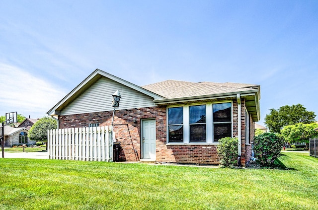 14879 Harbor Dr, Oak Forest, IL 60452 - view of front facade featuring brick siding, a front lawn, and a shingled roof
