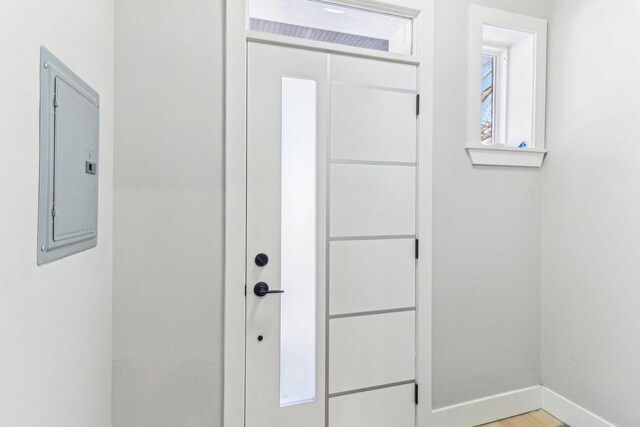 2307 N Avers Ave Unit 2, Chicago, IL 60647 - doorway to outside featuring baseboards and electric panel