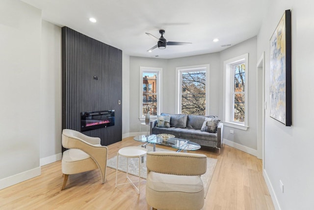 2307 N Avers Ave Unit 2, Chicago, IL 60647 - living room featuring wood finished floors, a glass covered fireplace, a ceiling fan, and recessed lighting
