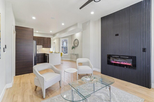 2307 N Avers Ave Unit 2, Chicago, IL 60647 - living area featuring light wood-type flooring, ceiling fan, a glass covered fireplace, and recessed lighting
