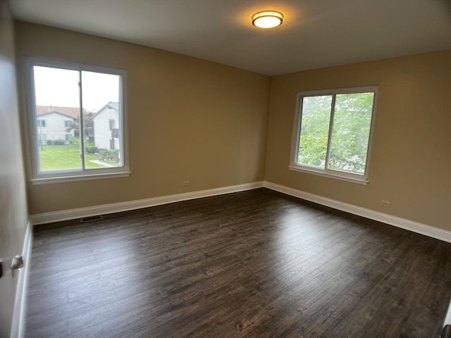 1318 Kingsbury Dr Unit 1, Hanover Park, IL 60133 - spare room with dark wood-style floors