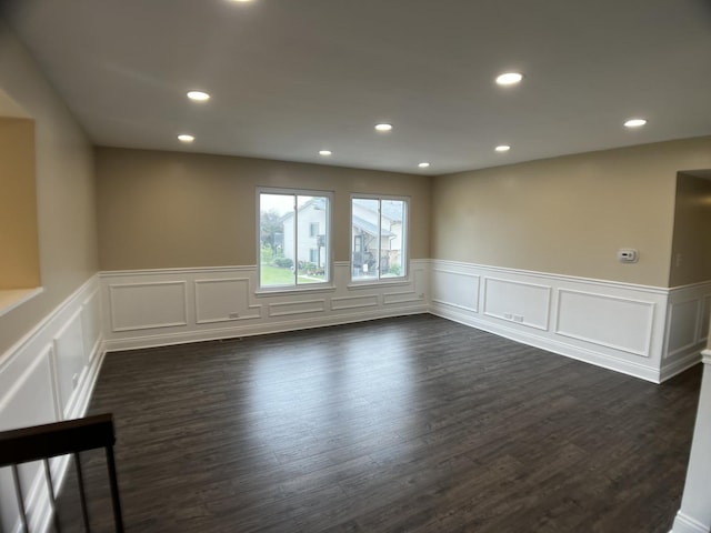 1318 Kingsbury Dr Unit 1, Hanover Park, IL 60133 - empty room featuring a wainscoted wall, recessed lighting, dark wood-style floors, and a decorative wall