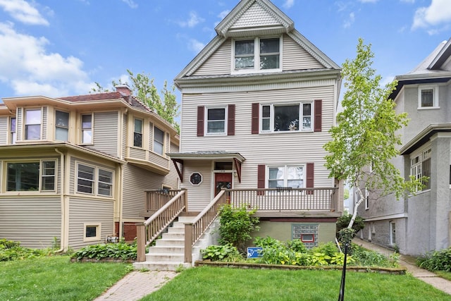 1330 W Norwood Ave, Chicago, IL 60660 - view of front of house with a front lawn and a wooden deck