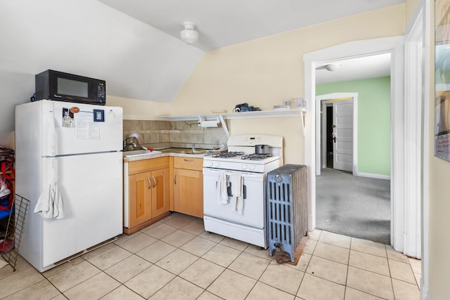 1330 W Norwood Ave, Chicago, IL 60660 - kitchen featuring white appliances, vaulted ceiling, light tile patterned floors, light countertops, and light brown cabinetry