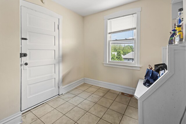 1330 W Norwood Ave, Chicago, IL 60660 - laundry room with baseboards and light tile patterned floors