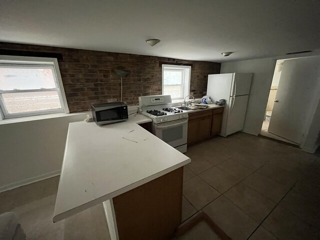 1330 W Norwood Ave, Chicago, IL 60660 - kitchen with white appliances, light countertops, and light tile patterned floors
