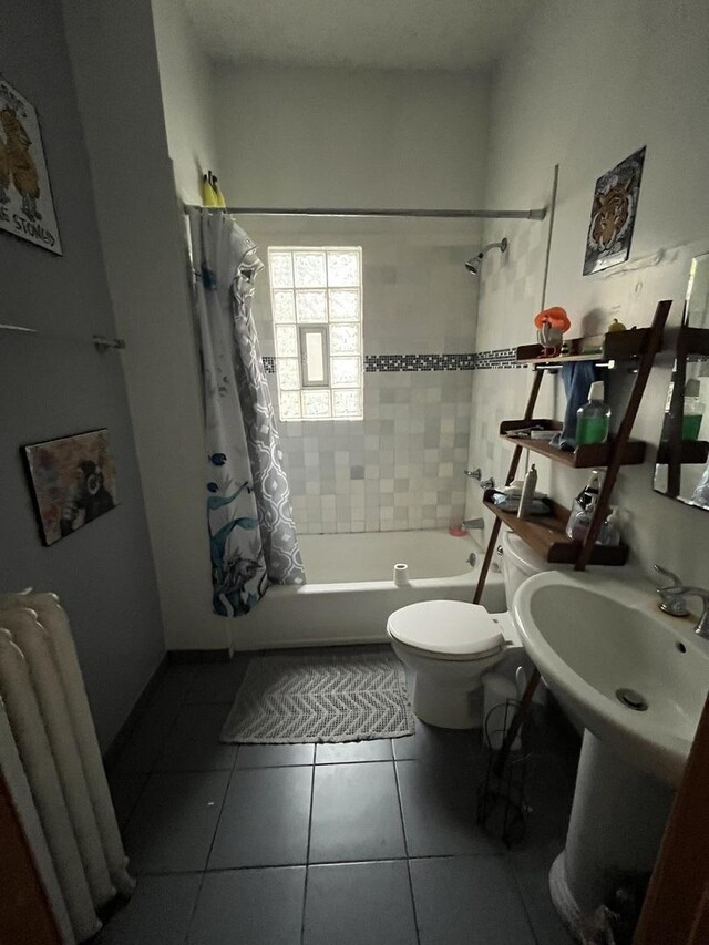 1330 W Norwood Ave, Chicago, IL 60660 - bathroom with shower / tub combo with curtain and tile patterned flooring