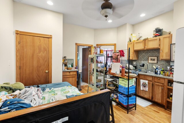 1330 W Norwood Ave, Chicago, IL 60660 - bedroom featuring light wood finished floors, freestanding refrigerator, and recessed lighting