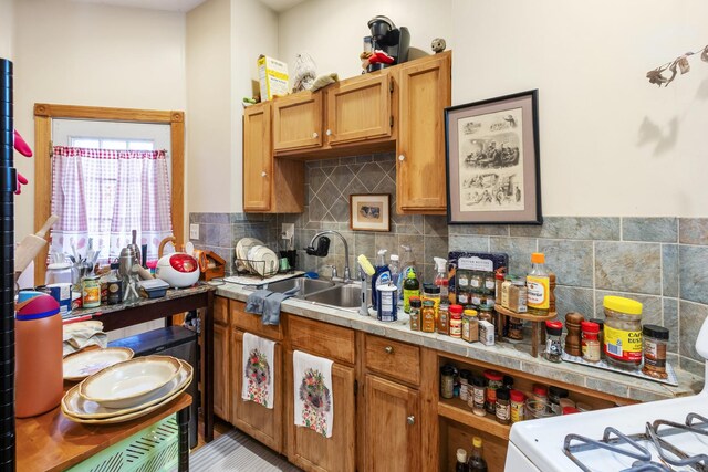 1330 W Norwood Ave, Chicago, IL 60660 - kitchen featuring light countertops, tasteful backsplash, and brown cabinets