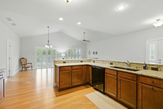 15701 Cove Cir, Plainfield, IL 60544 - kitchen featuring black dishwasher, light wood-style flooring, healthy amount of natural light, vaulted ceiling, and recessed lighting