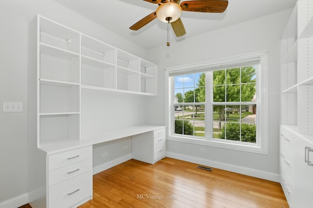 15701 Cove Cir, Plainfield, IL 60544 - unfurnished office featuring built in desk, healthy amount of natural light, light wood-type flooring, and a ceiling fan
