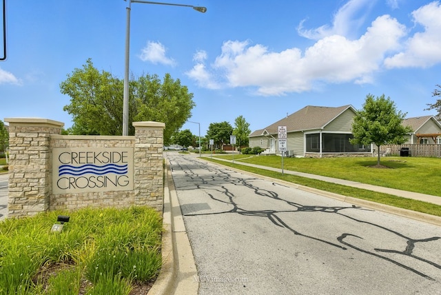 15701 Cove Cir, Plainfield, IL 60544 - view of asphalt road with street lights, sidewalks, curbs, and traffic signs