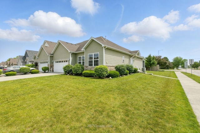 15701 Cove Cir, Plainfield, IL 60544 - view of front of property featuring stone siding, driveway, and a front lawn