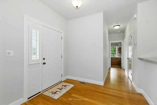 15701 Cove Cir, Plainfield, IL 60544 - entrance foyer featuring light wood-type flooring and baseboards