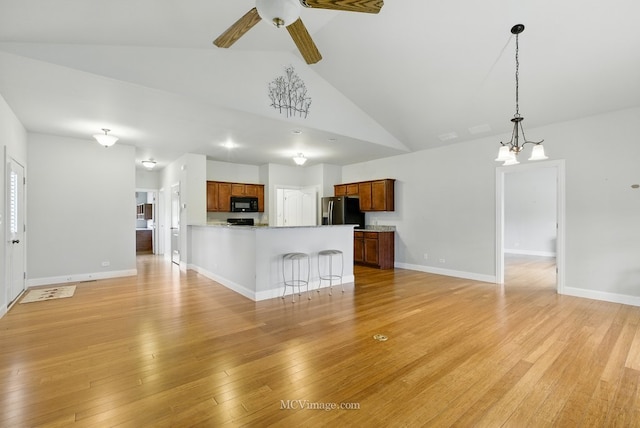 15701 Cove Cir, Plainfield, IL 60544 - unfurnished living room with ceiling fan, high vaulted ceiling, and light wood-style flooring