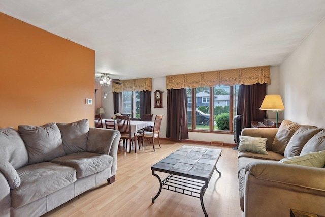 10956 S Nagle Ave, Worth, IL 60482 - living area with healthy amount of natural light, light wood finished floors, and a ceiling fan