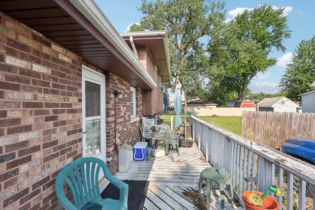 10956 S Nagle Ave, Worth, IL 60482 - wooden terrace with outdoor dining space
