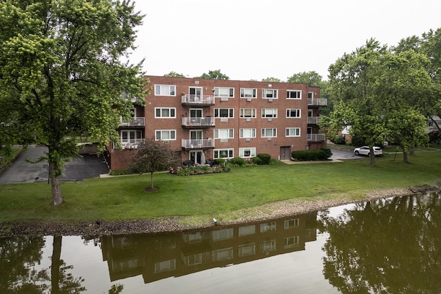 101 N Peartree Ln Unit 101, Arlington Heights, IL 60004 - dock with a water view and a lawn