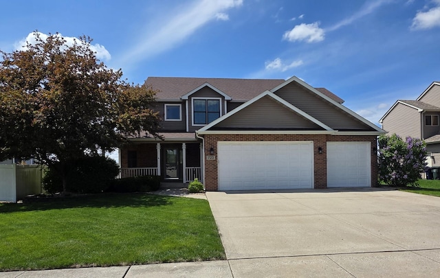 723 Casey Dr, Minooka, IL 60447 - view of front of property featuring brick siding, an attached garage, concrete driveway, a front lawn, and a porch