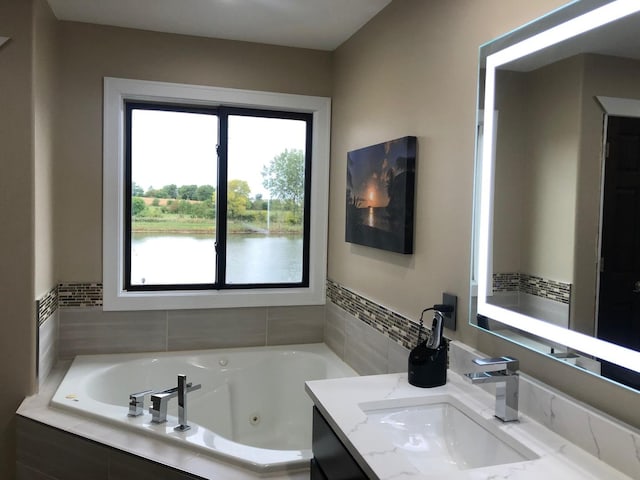 723 Casey Dr, Minooka, IL 60447 - bathroom featuring vanity and a tub with jets