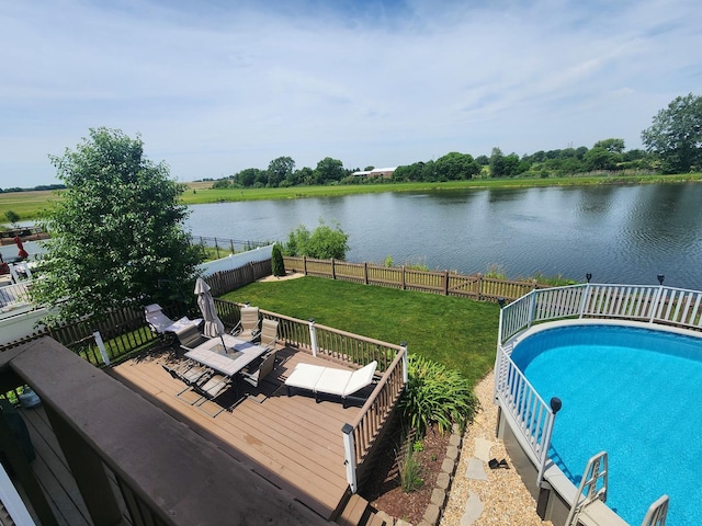 723 Casey Dr, Minooka, IL 60447 - view of swimming pool featuring a deck with water view and a fenced backyard