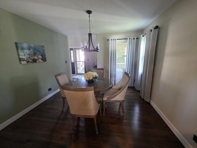 723 Casey Dr, Minooka, IL 60447 - dining space with a chandelier and dark wood-style floors