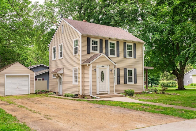 310 Virgil St, Maple Park, IL 60151 - view of front of property with dirt driveway, an outbuilding, and a detached garage
