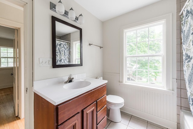 310 Virgil St, Maple Park, IL 60151 - full bathroom with vanity, a wainscoted wall, a shower with shower curtain, and a tub