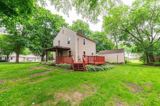 310 Virgil St, Maple Park, IL 60151 - rear view of house with a chimney, a wooden deck, and a yard