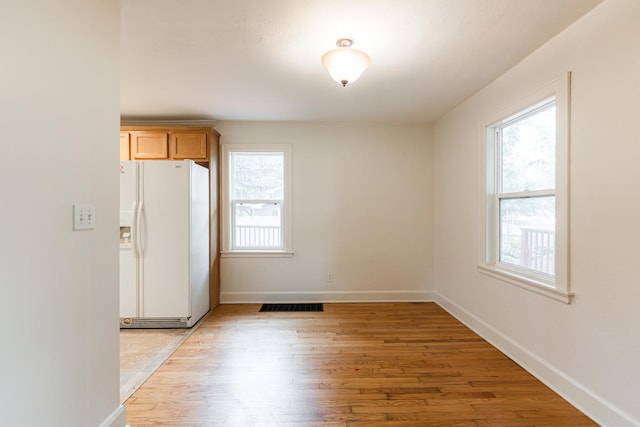 310 Virgil St, Maple Park, IL 60151 - unfurnished dining area featuring healthy amount of natural light and light wood-type flooring