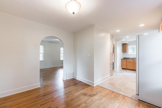 310 Virgil St, Maple Park, IL 60151 - unfurnished room featuring arched walkways, light wood finished floors, and recessed lighting