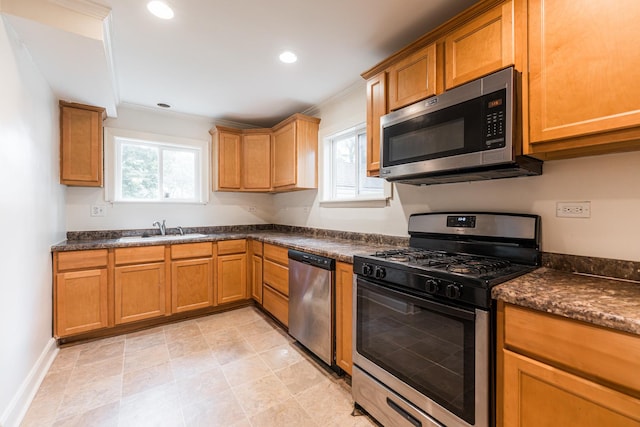 310 Virgil St, Maple Park, IL 60151 - kitchen with stainless steel appliances, dark countertops, crown molding, recessed lighting, and brown cabinetry